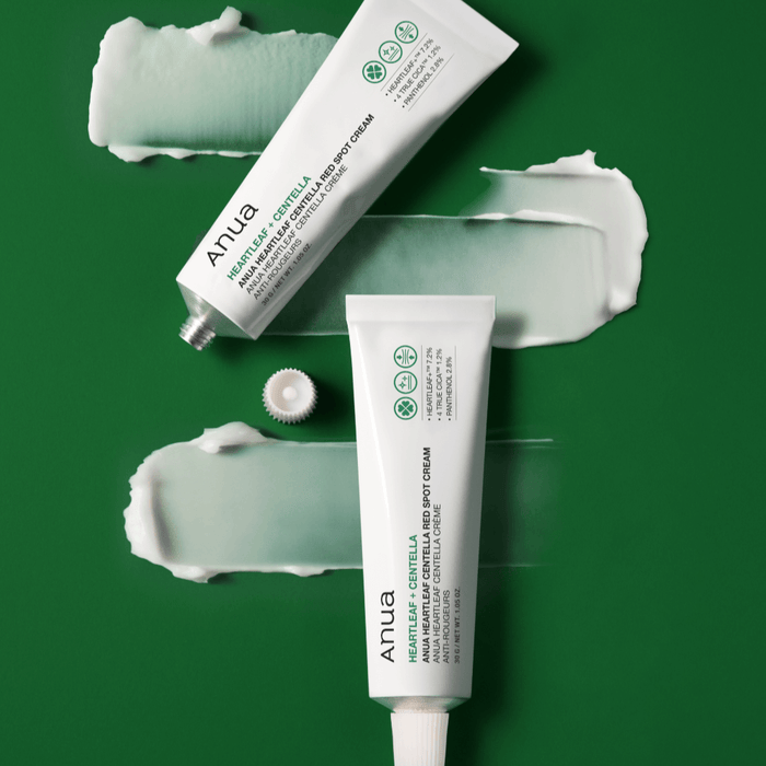 ANUA Centella Red Spot Cream with Asungcho on green background with cream texture