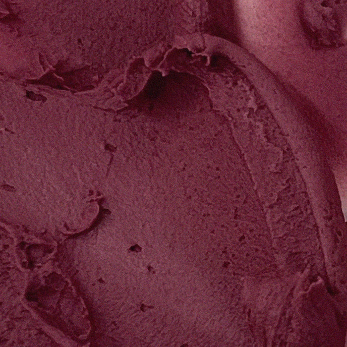 Close-up of AOU Floofy Matte Balm texture in rich burgundy shade.