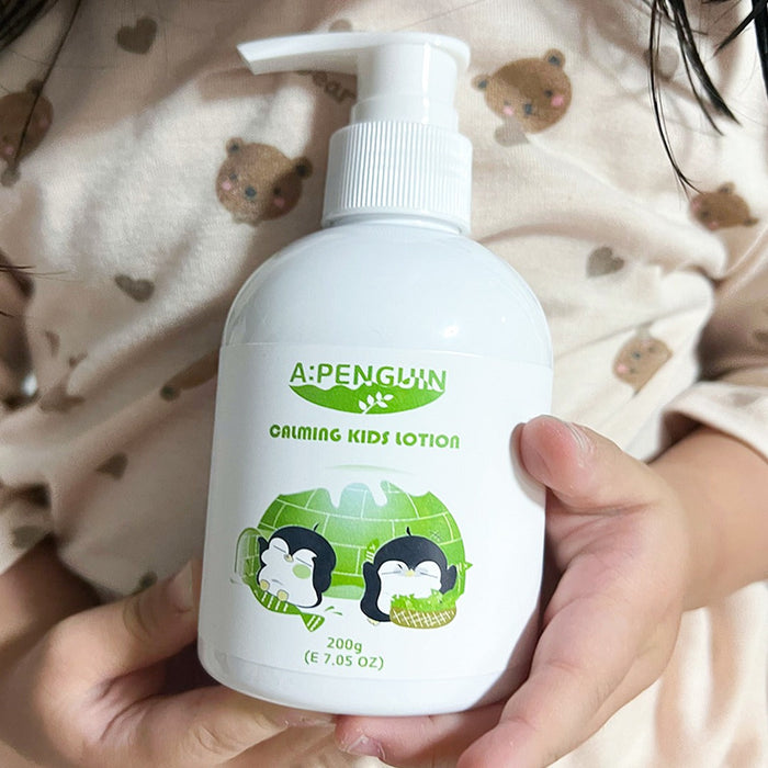 ATOMANDE Arctic Penguin Kids Children Calming Lotion Skin Soothing Moisturizing Body 200ml bottle held in child's hands