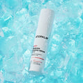 ATOPALM Newborn Calming Serum 50ml bottle in ice, highlighting hydrating properties