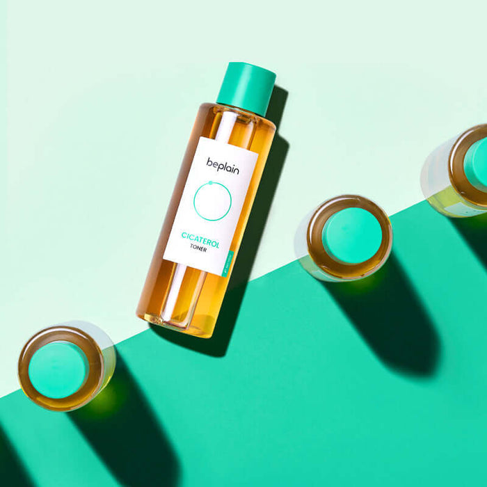 BEPLAIN Cicaterol Toner product bottle on a green background, highlighting the skincare toner for soothing and hydrating the skin.