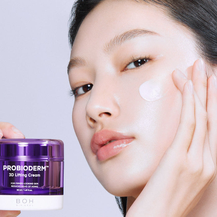 Woman applying BIO HEAL BOH Probioderm 3D Lifting Cream 50ml on her face for skin rejuvenation and lifting effect.
