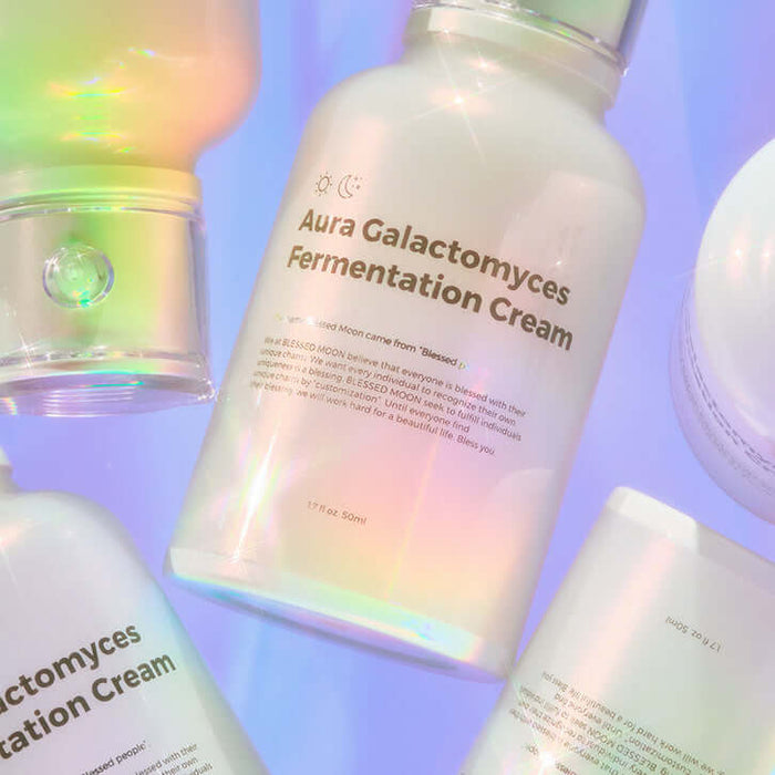BLESSED MOON Aura Galactomyces Fermented Cream 50ml product packaging with iridescent glow and text visible on light background.