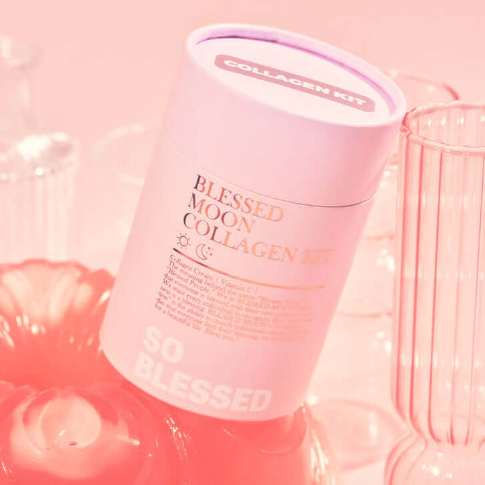 BLESSED MOON Collagen Kit in pink cylindrical packaging with decorative glassware in the background.