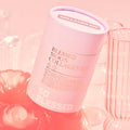 BLESSED MOON Collagen Kit in pink cylindrical packaging with decorative glassware in the background.