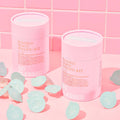 BLESSED MOON Pelling Kit with pink packaging and skincare products on a pink tiled background.