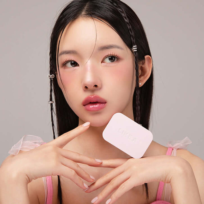 Woman holding a BLESSED MOON Soap Palette in her hand, showcasing the product's pastel design and highlighting its elegance and functionality.
