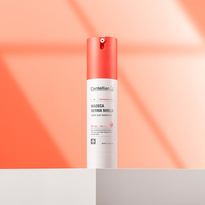 CENTELLIAN 24 Madeca Derma Sheild Safe Sun Essence 40ml product image on display with orange background.