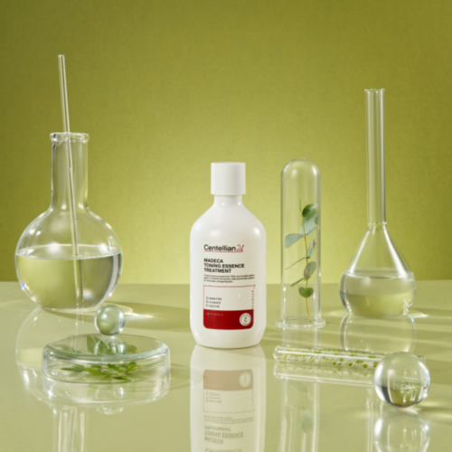 CENTELLIAN 24 Madeca Toning Essence Treatment 300ml bottle surrounded by laboratory glassware on a green background.