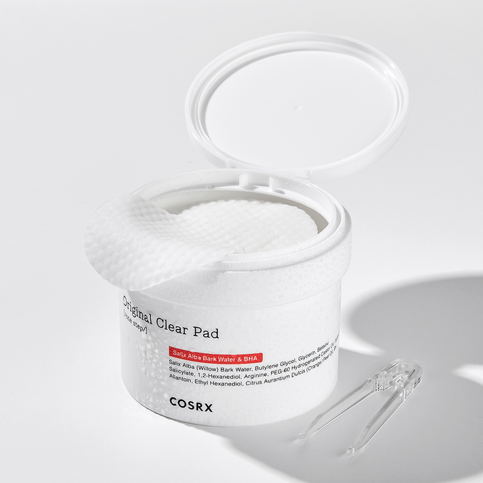 COSRX One Step Original Clear Pad 140ml, open jar showing texture of clear pads with included tweezers, 140ml packaging.