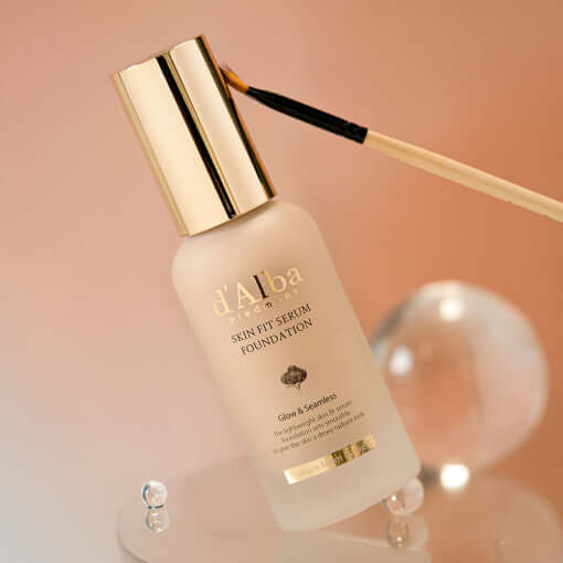 D'ALBA Vegan Skin Fit Serum Foundation bottle with brush, displayed elegantly