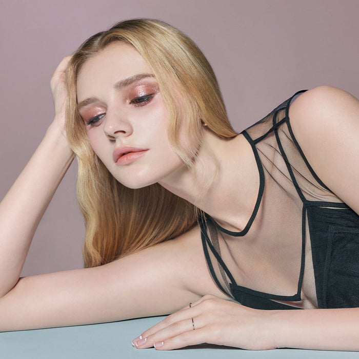 Model showcasing DEAR DAHLIA Perfect Designing Shadow Stick with shimmering eye makeup look.