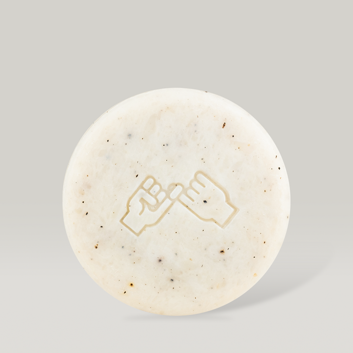 DONGGUBAT Field Correct Body Soap Noni bar with embossed design on a neutral background. Enhance skincare routine with natural ingredients.