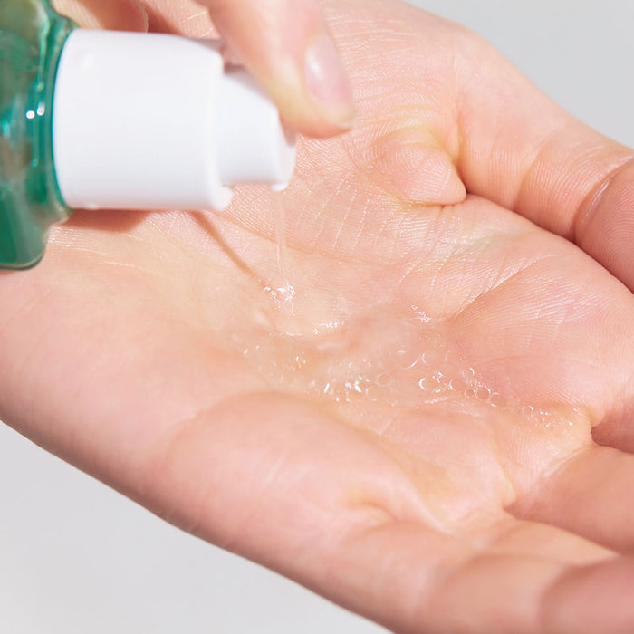 Dispensing DR. JART+ Pore Remedy PHA Exfoliating Serum 30ml onto hand.