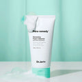 DR. JART+ Pore Remedy Renewing Foam Cleanser 150ml tube with foam bubbles against green background
