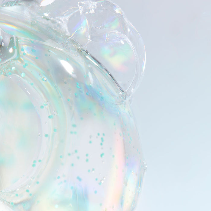 Close-up of DR. JART+ Pore Remedy Renewing Foam Cleanser 150ml texture with iridescent bubbles