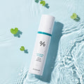 DR.CEURACLE Cica Regen 92 Toner 120ml bottle on water with leaves