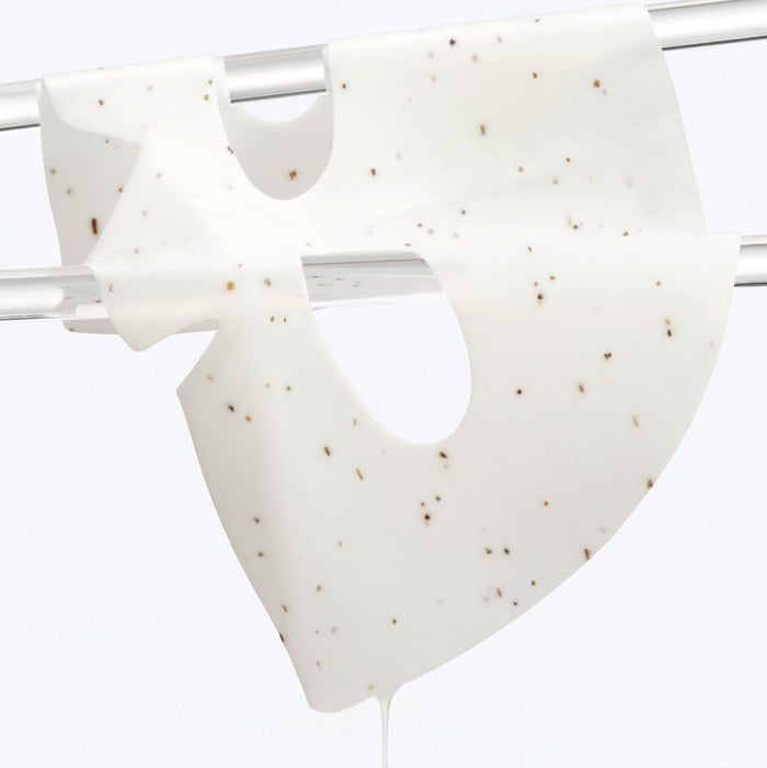 Close-up of DR.G Red Blemish Hyal Cica Cooling Gel Mask 1 Sheets on a drying rack, showcasing its texture and cooling properties.