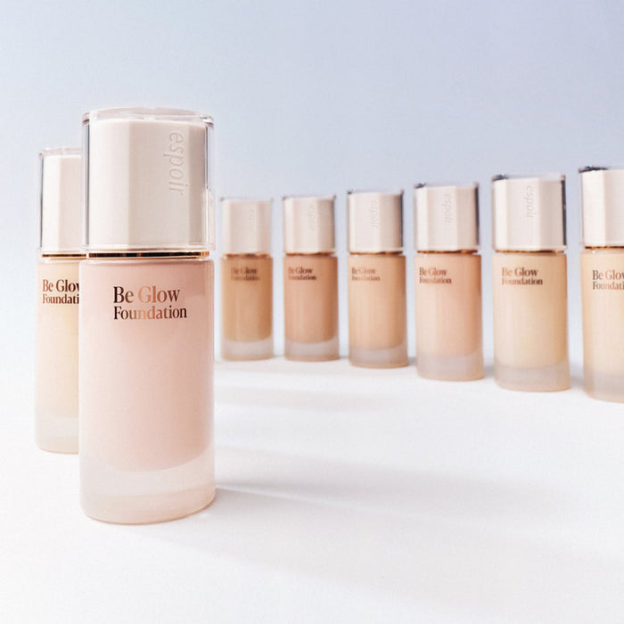 ESPOIR BE GLOW FOUNDATION SPF27 PA++ bottles in various shades. Enhance your skin's radiance with this premium foundation.