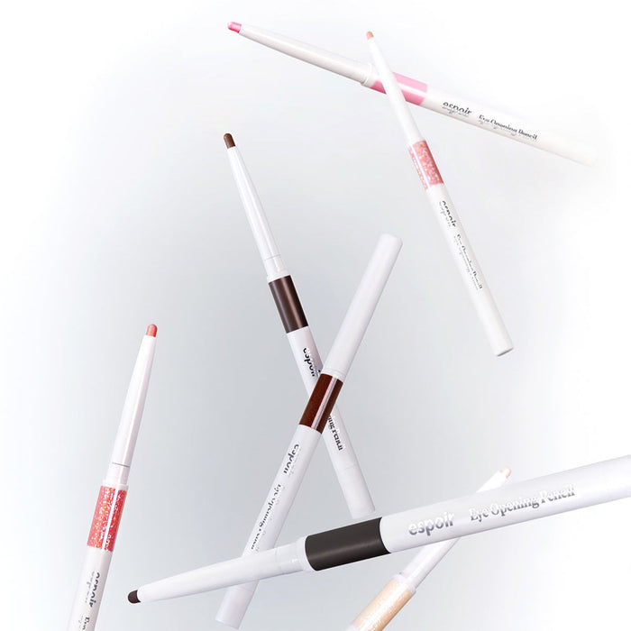 Various shades of ESPOIR Eye opening pencil floating in a stylish arrangement, showcasing their colors and sleek design.