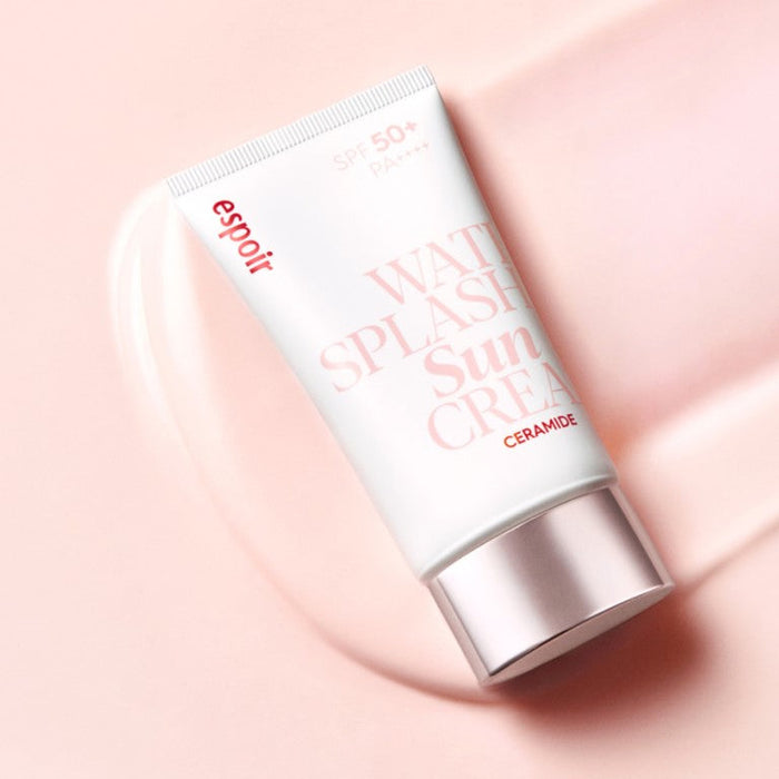 ESPOIR Water Splah Sun Cream Ceramide SPF50 + PA++++ 60ml tube on a soft pink background