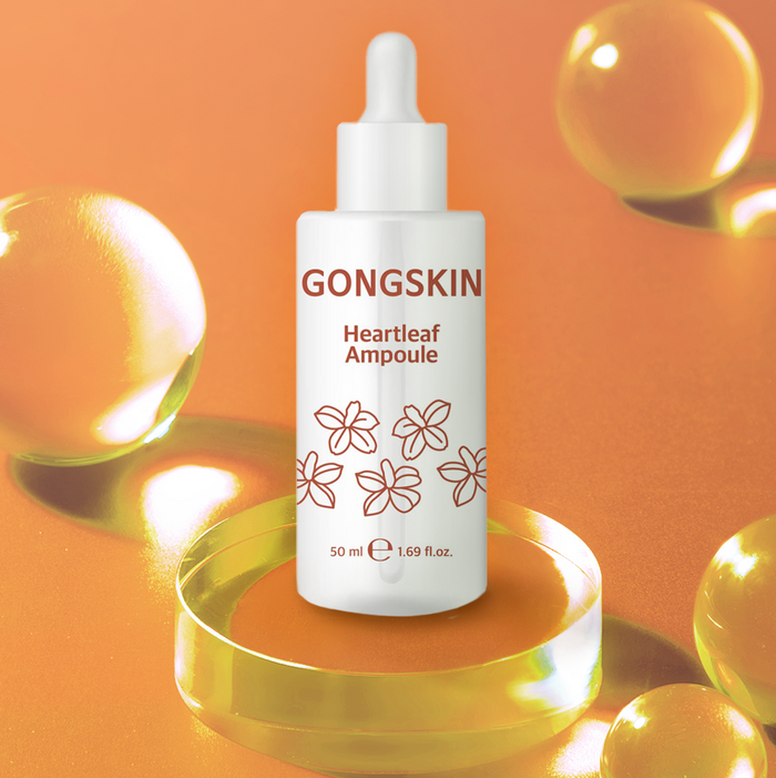 GONGSKIN Heartleaf Ampoule 50ml on orange background with dewy effect showcasing skincare product