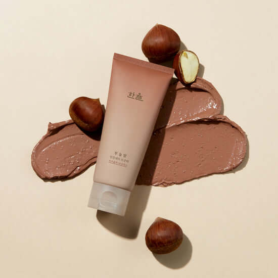 HANYUL Buddle Night Cleansing Pore Pad next to spread cream texture and chestnuts on a beige background