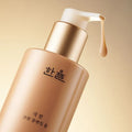 HANYUL Extreme Cream Cleansing Foam 200ml bottle with pump dispenser against golden background
