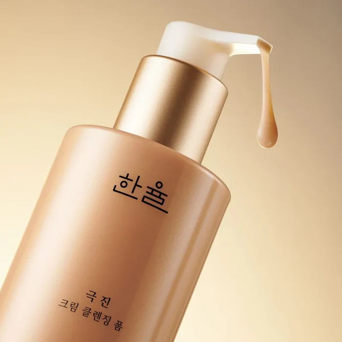HANYUL Extreme Cream Cleansing Foam 200ml bottle with pump dispenser against golden background