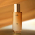 HANYUL Extreme Skin 125ml in a sleek bottle with a golden cap against a warm background.