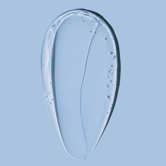 Texture of HARU HARU Black Rice Hyaluronic Essence 50ml on a blue background