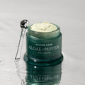 HEIMISH Marine Care Algae+Panthenol Eye Cream 30ml in an open jar on a reflective surface