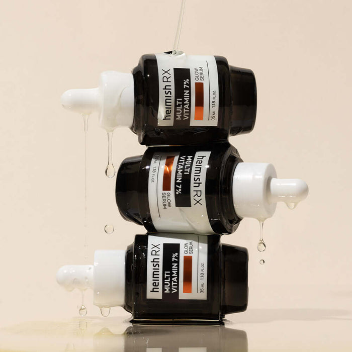 Stacked bottles of HEIMISH RX Multi Vitamin Glow Serum 35ml, showcasing its vibrant formula and sleek packaging design.