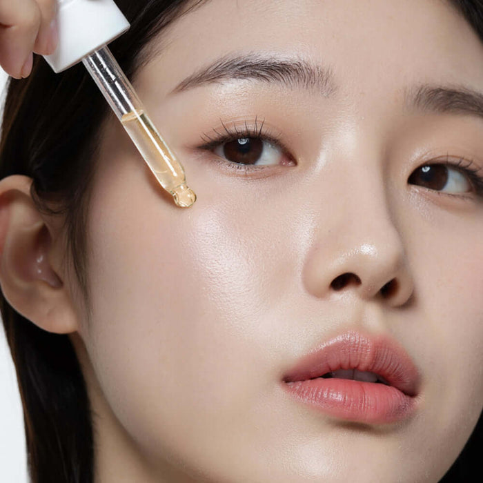 Applying HEIMISH RX Multi Vitamin Glow Serum 35ml to skin for radiant glow