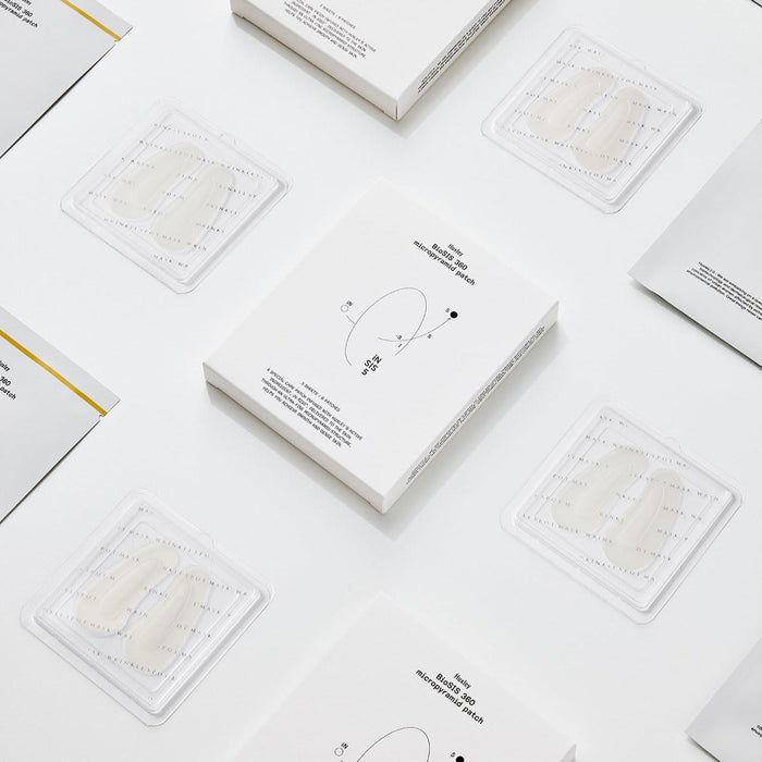 Display of HUXLEY BioSIS 360 Micropyramid Patch packaging and patches on a white background.