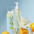 HUXLEY Body Wash Blue Medina Tangerine with citrus and floral backdrop
