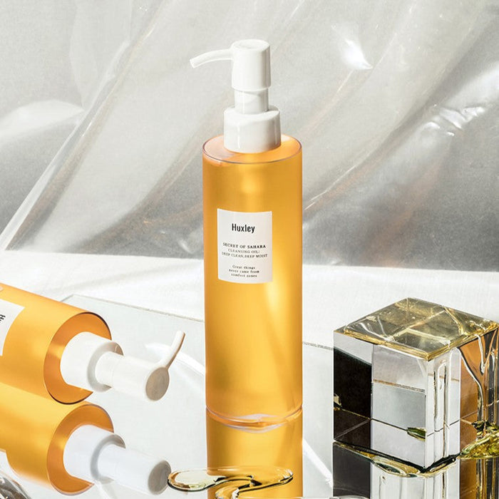 HUXLEY Cleansing Oil Deep Clean, Deep Moist 200ml bottle displayed elegantly on a reflective surface.