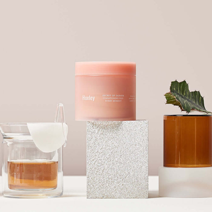 HUXLEY Conditioning Pad Every Moment with skincare setup on display
