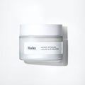 HUXLEY Cream Glow Awakening 50ml in a frosted jar with white lid, offering skin moisturizing and brightening benefits for a radiant glow.