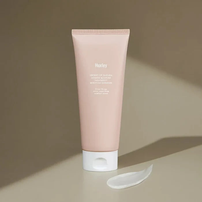 HUXLEY Intense Moisture Treatment Moroccan Gardener tube with cream swatch on brown background