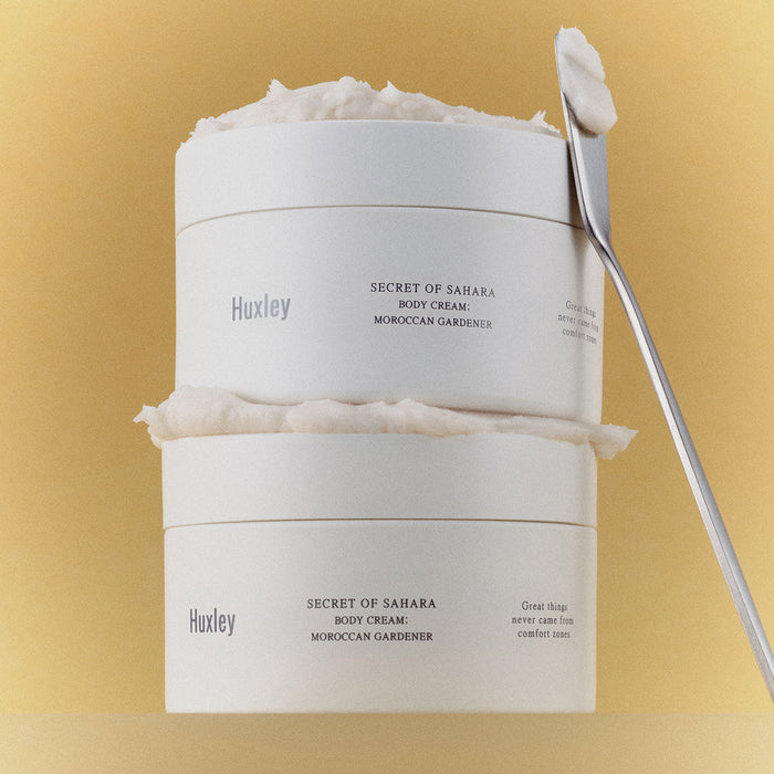 HUXLEY Moroccan Gardener Body Cream 200ml stacked jars with spatula on a beige background