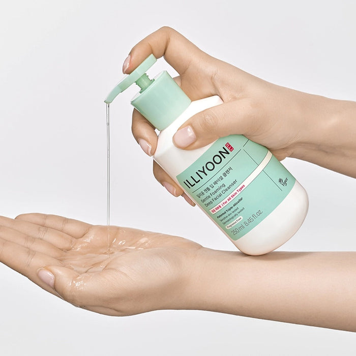 Person using ILLIYOON Gentle Deep Facial Cleanser 250ml, dispensing product into palm for skincare routine.