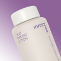 INNISFREE Jeju Orchid Lotion 170ml bottle with gradient background