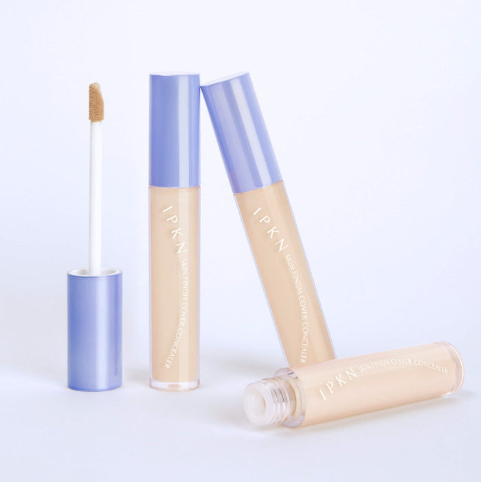 IPKN Skin Finish Cover Concealer SPF30 PA++ shown with open and closed tubes for skin coverage and sun protection.
