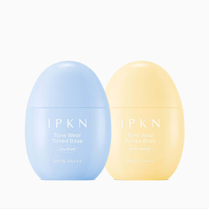 Two bottles of IPKN Tone Wear Tinted Base in icy blue and soft lemon shades with SPF35, PA+++, ideal for even skin tone.