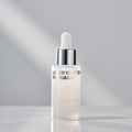 ISOI Whitening Ampoule/Laser Whitening Program 30ml in a sleek bottle on a smooth surface.