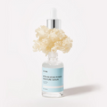 IUNIK Beta Glucan Power Moisture Serum 50ml bottle with natural ingredients background.