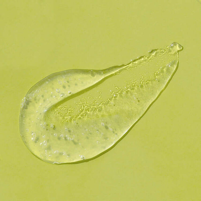 Close-up of iUNIK Lime Moisture Mild Peeling Gel 90ml texture with lime extract, on a lime green background.