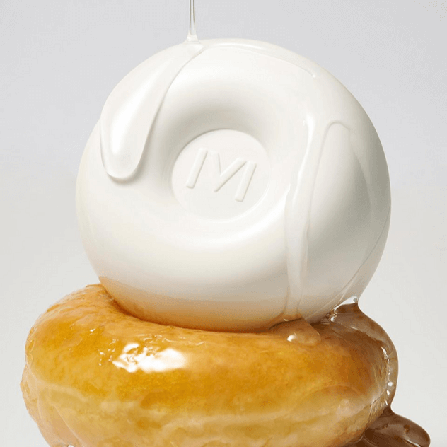 IVI MAD PEACH Glazed Glow Cushion showcased with glaze dripping on a donut, highlighting its unique texture and design.