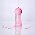 JULYME Damage Care Perfume Hair Oil 30ml (Sunset Freesia) pink bottle with spilled oil effect on white background